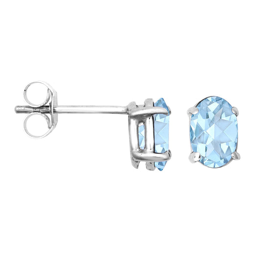 9ct White Gold Blue Oval Topaz Solitaire Stud Earrings 6x4mm - JES370