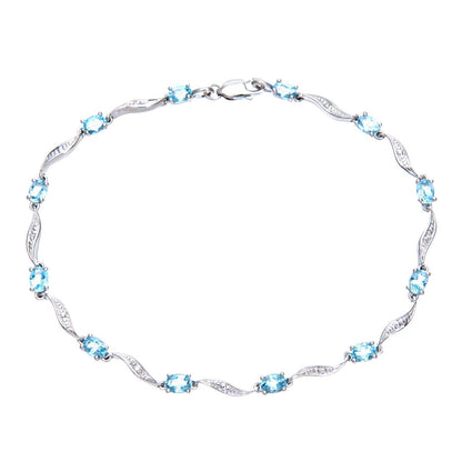 9ct White Gold  Diamond Oval Blue Topaz Wavy Ribbon Bracelet - PBCAXL02772WBT